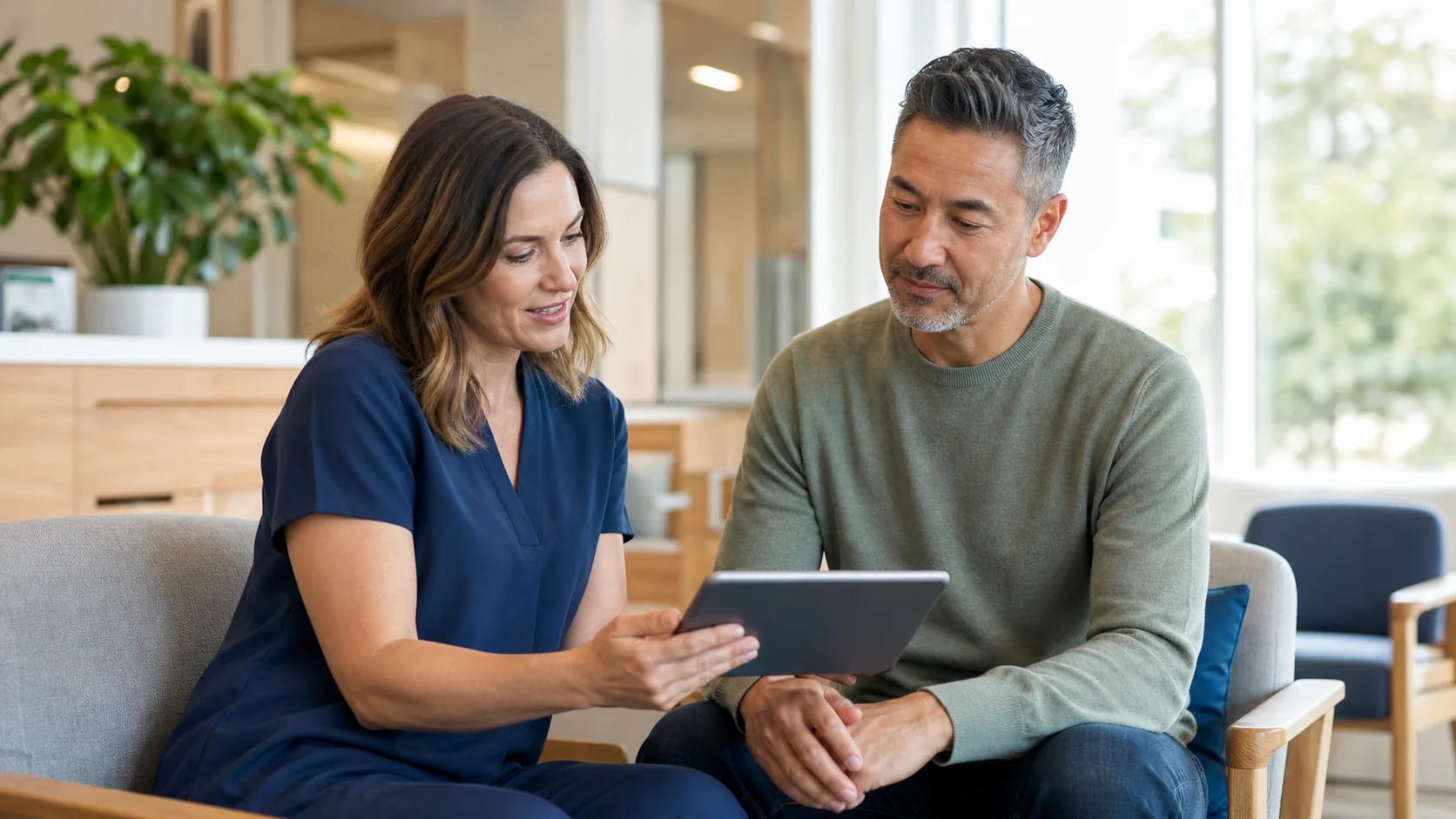Healthcare practitioner and patient reviewing a long-term care plan together